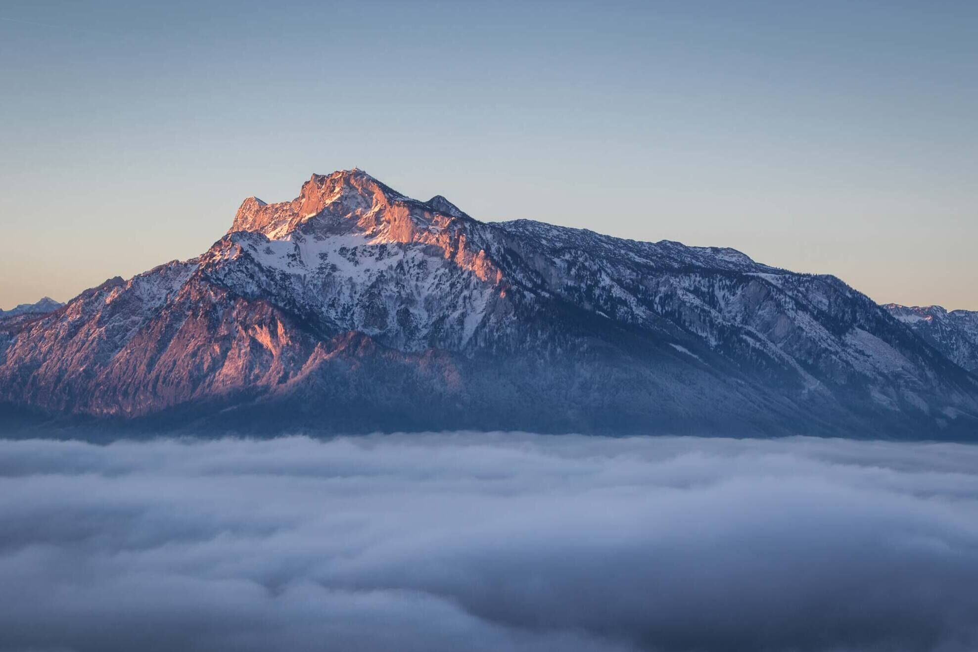 The Untersberg at dawn shrouded in a thick layer of mist