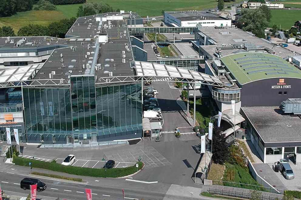 Large congress center with modern glass façade and parking facilities in Salzburg.